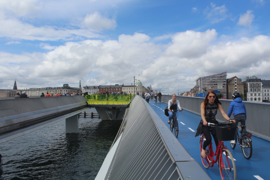 On top of walk-and bike bridge Inderhavnsbroen. Vie in direction north to Nyhavn and Copenhagen City